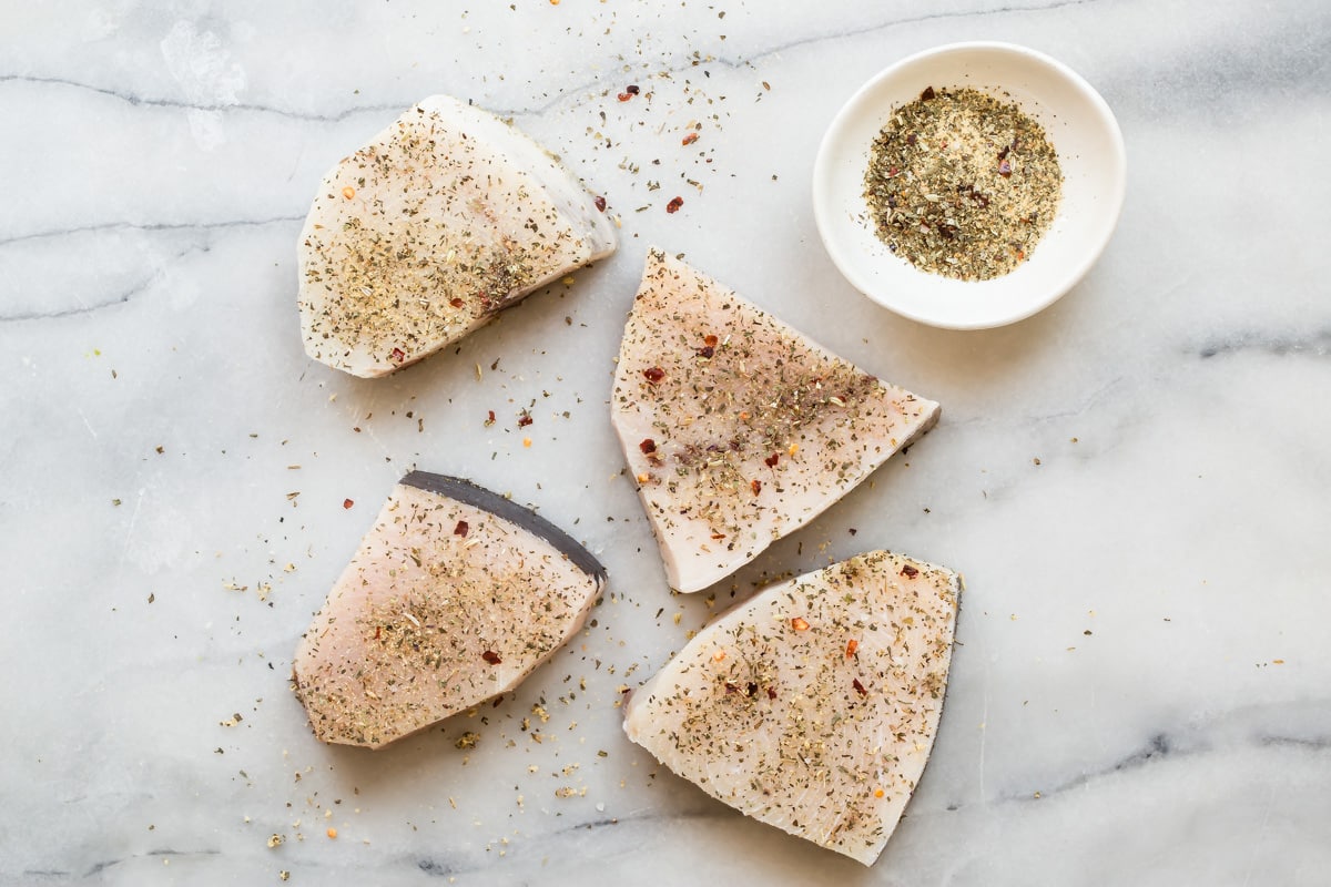Swordfish with dry rub before grilling.