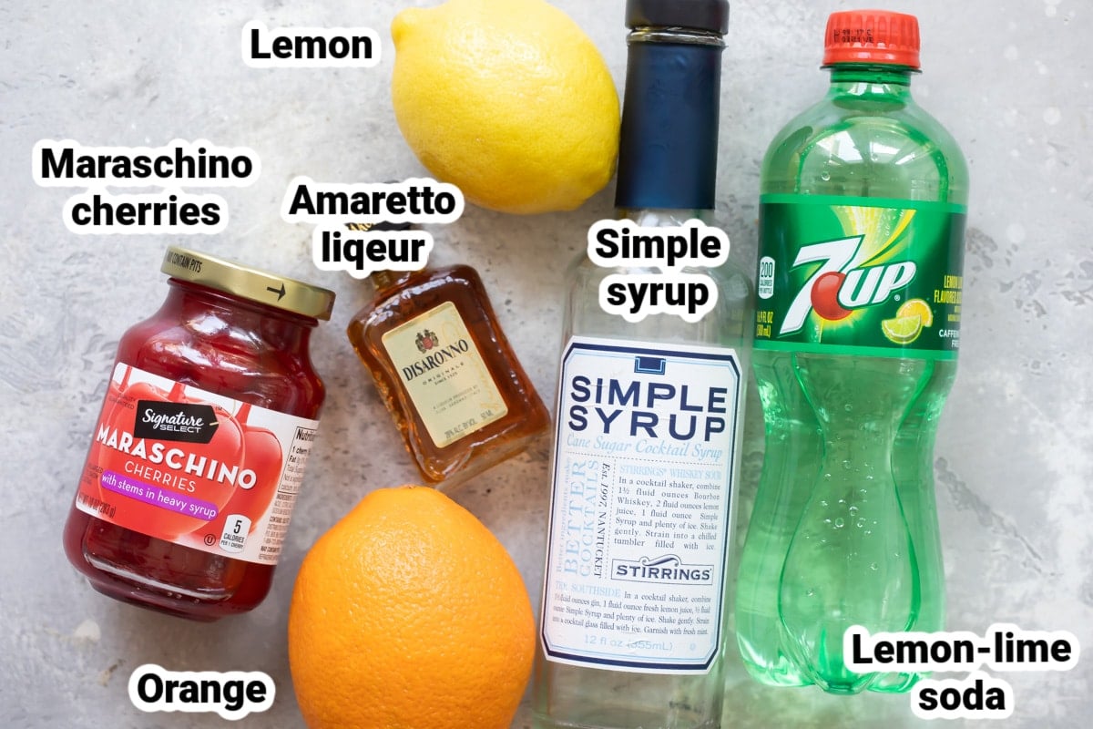 Labeled ingredients for amaretto sour cocktails.