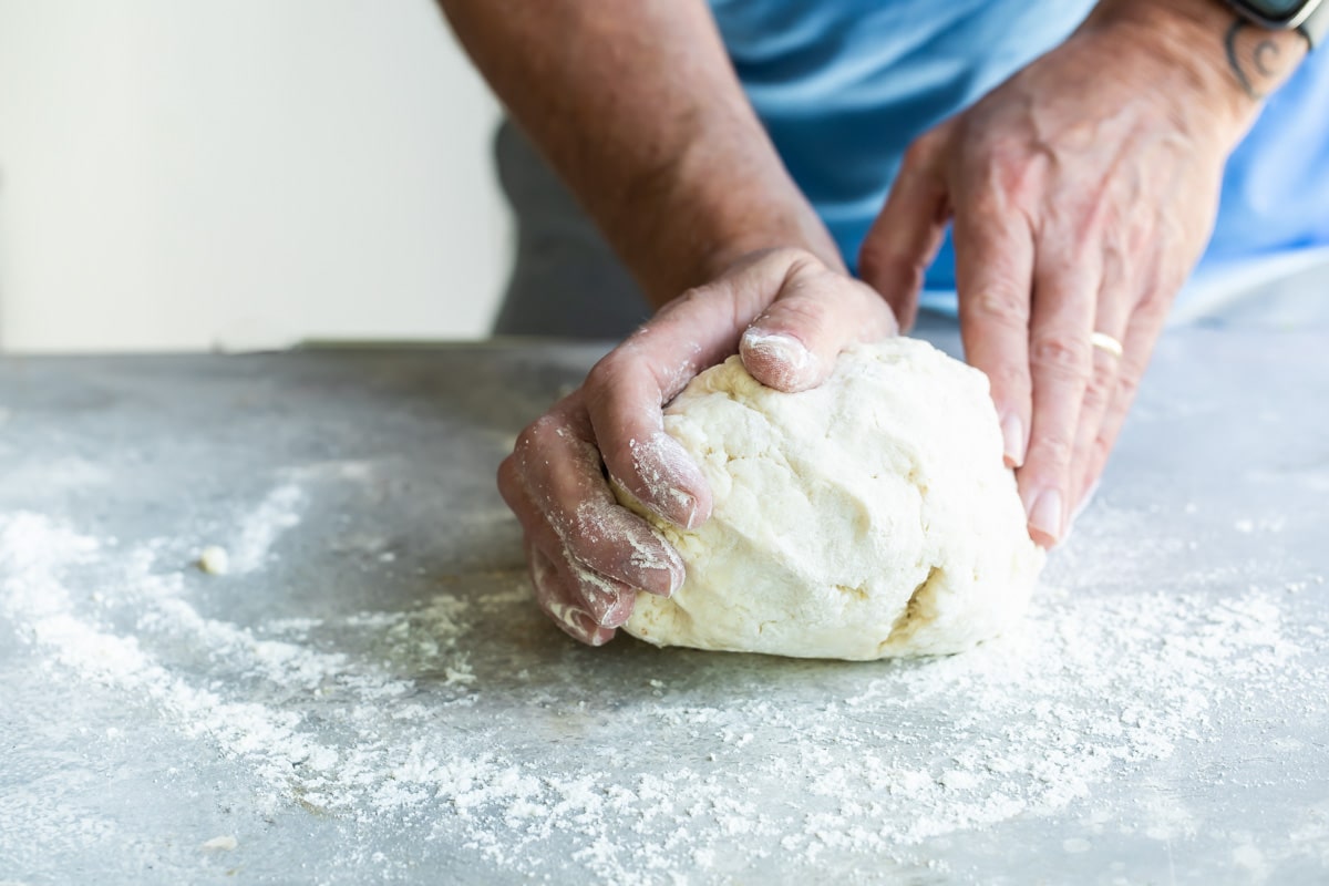 Rolling biscuit dough before rolling out.