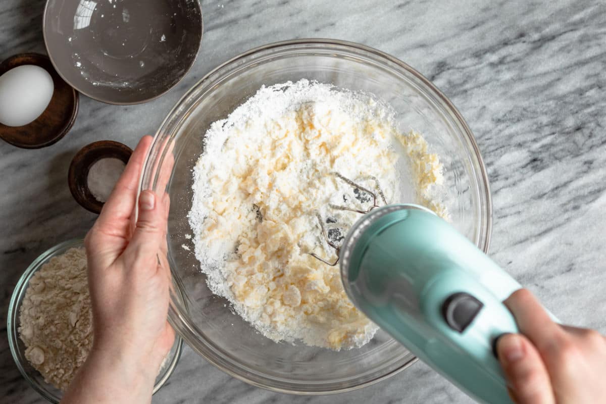 Creaming butter and sugar together in a mixing bowl.