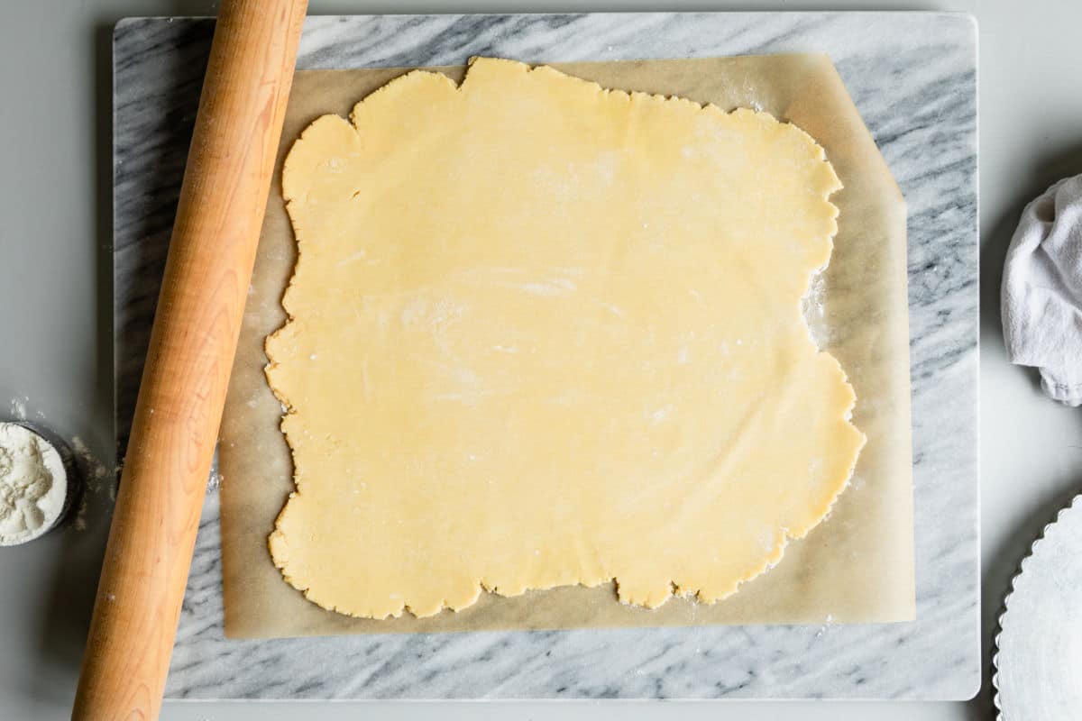 Rolling out tart dough.