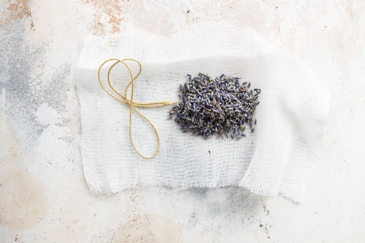 Dried lavender flowers in a piece of cheesecloth.