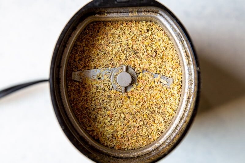 Lemon pepper seasoning in a spice grinder.