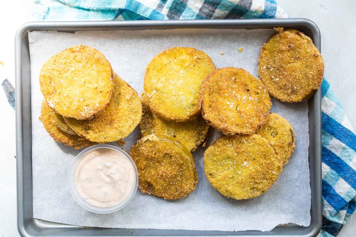 Fried green tomatoes on a baking sheet.