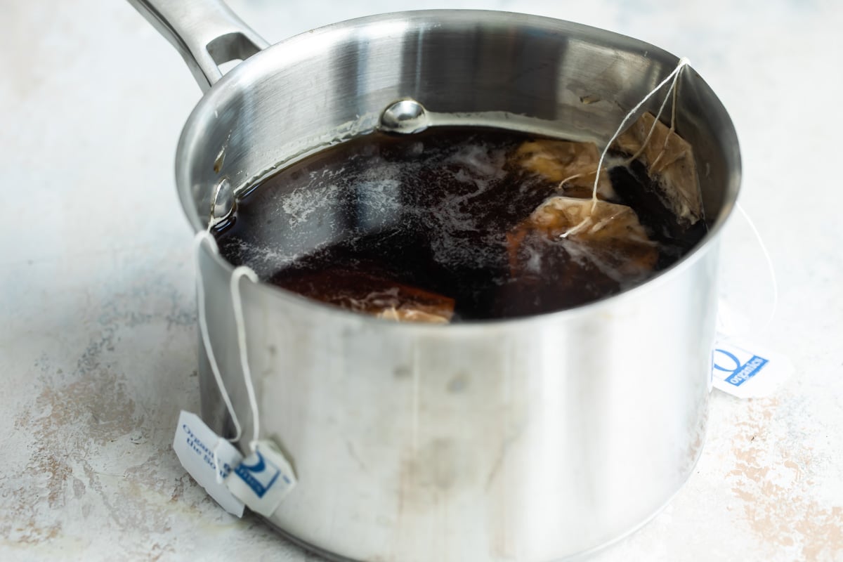 Boiling iced tea in a saucepan.
