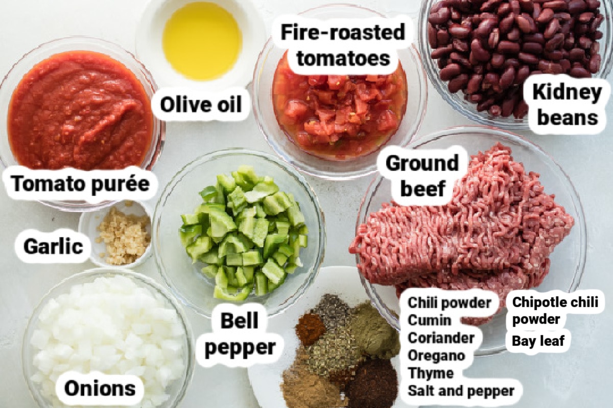 Labeled beef chili ingredients in various bowls.