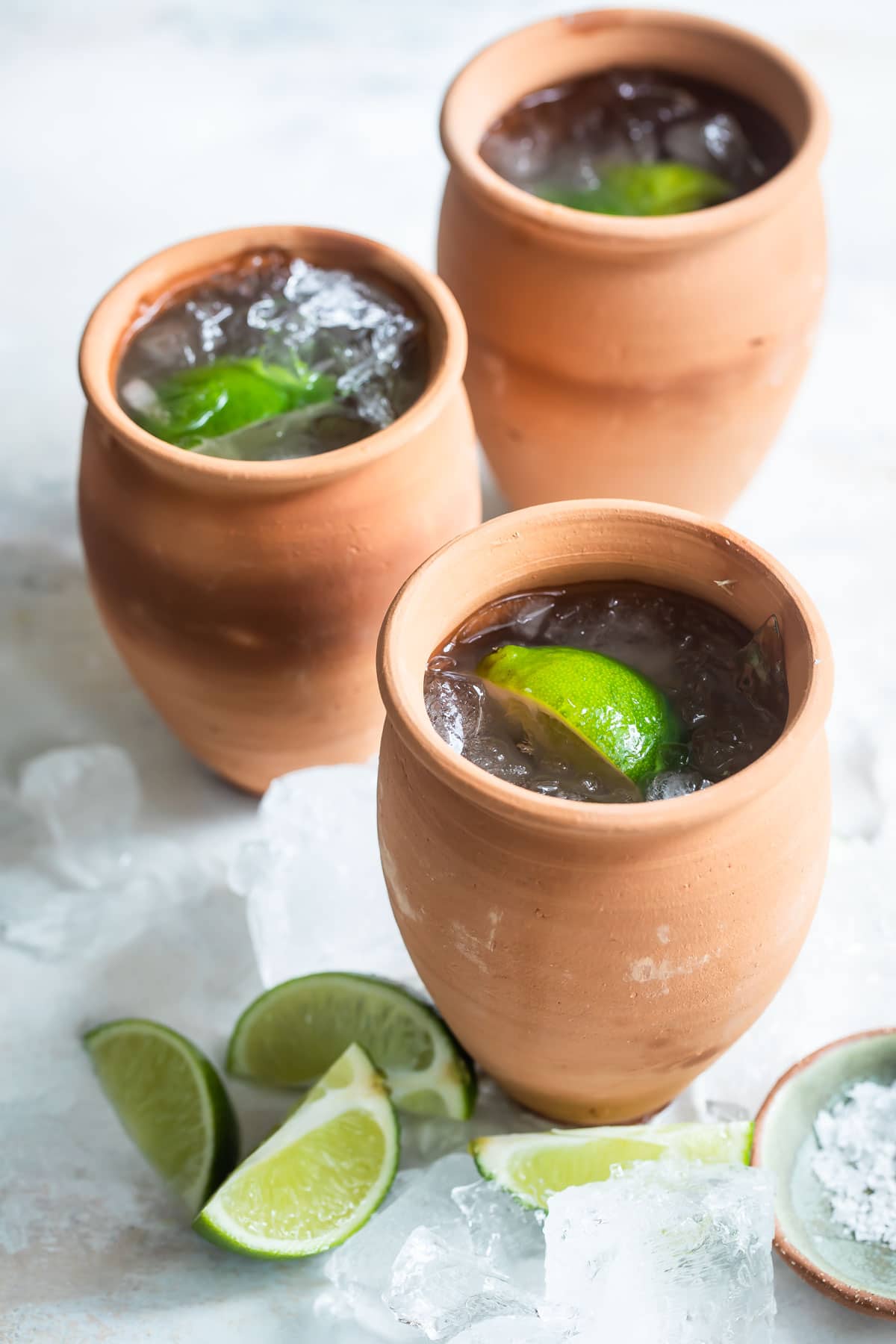 3 Cantarito cocktails in clay cups.