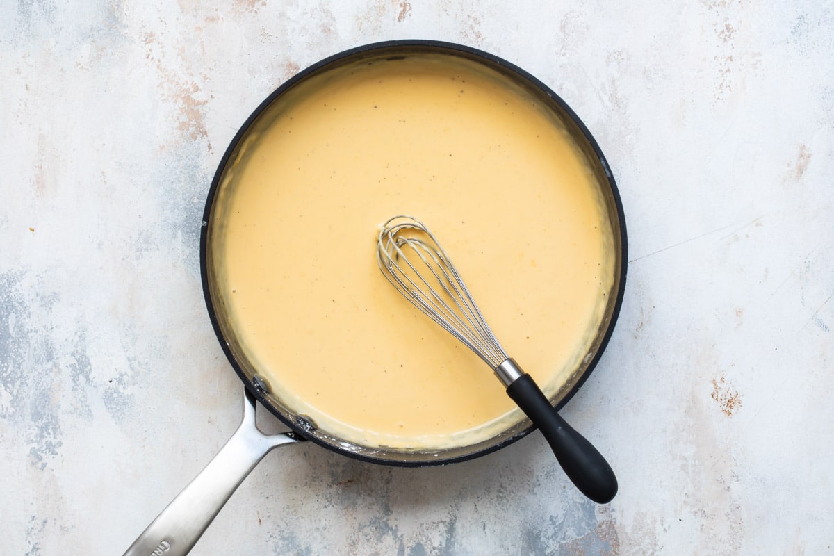 Cheese sauce in a sauce pan.