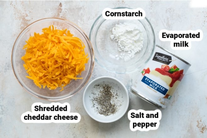 Labeled ingredients for homemade cheese sauce.