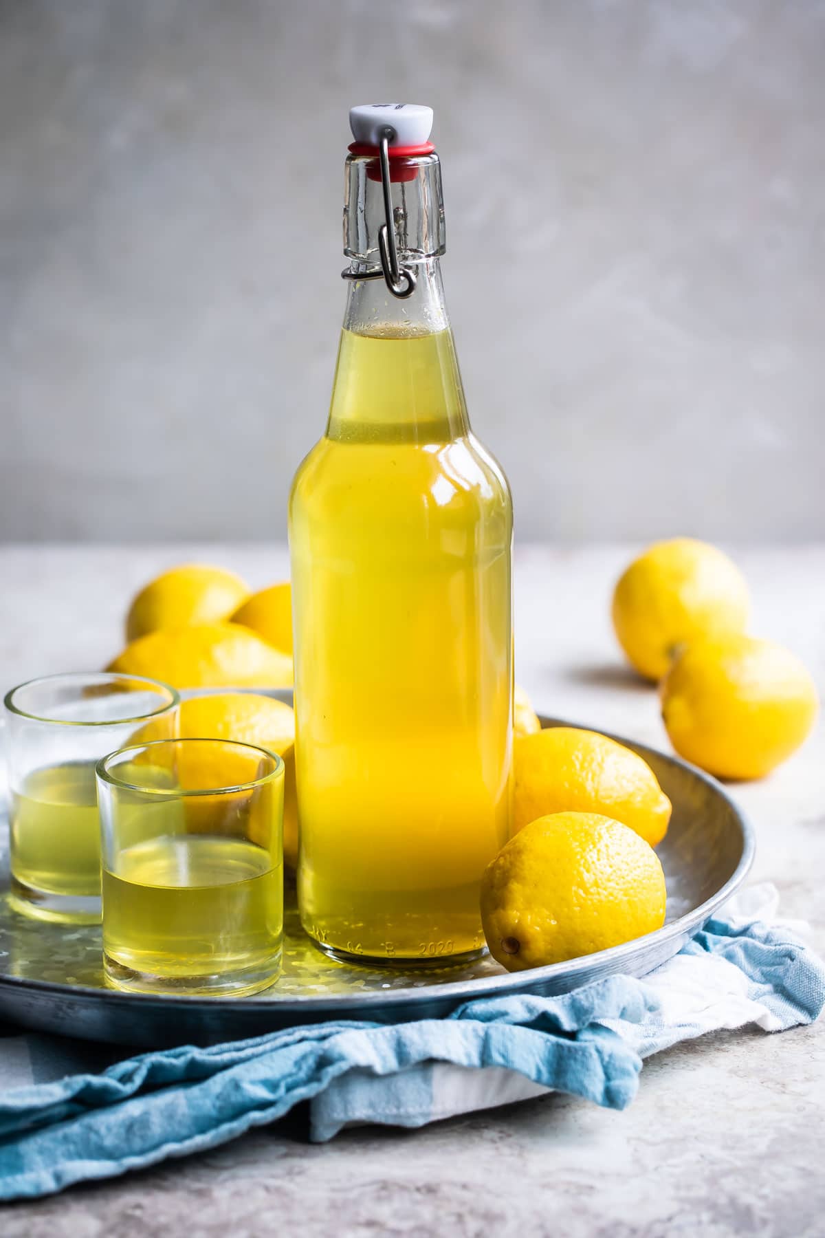 A glass bottle full of Limoncello.