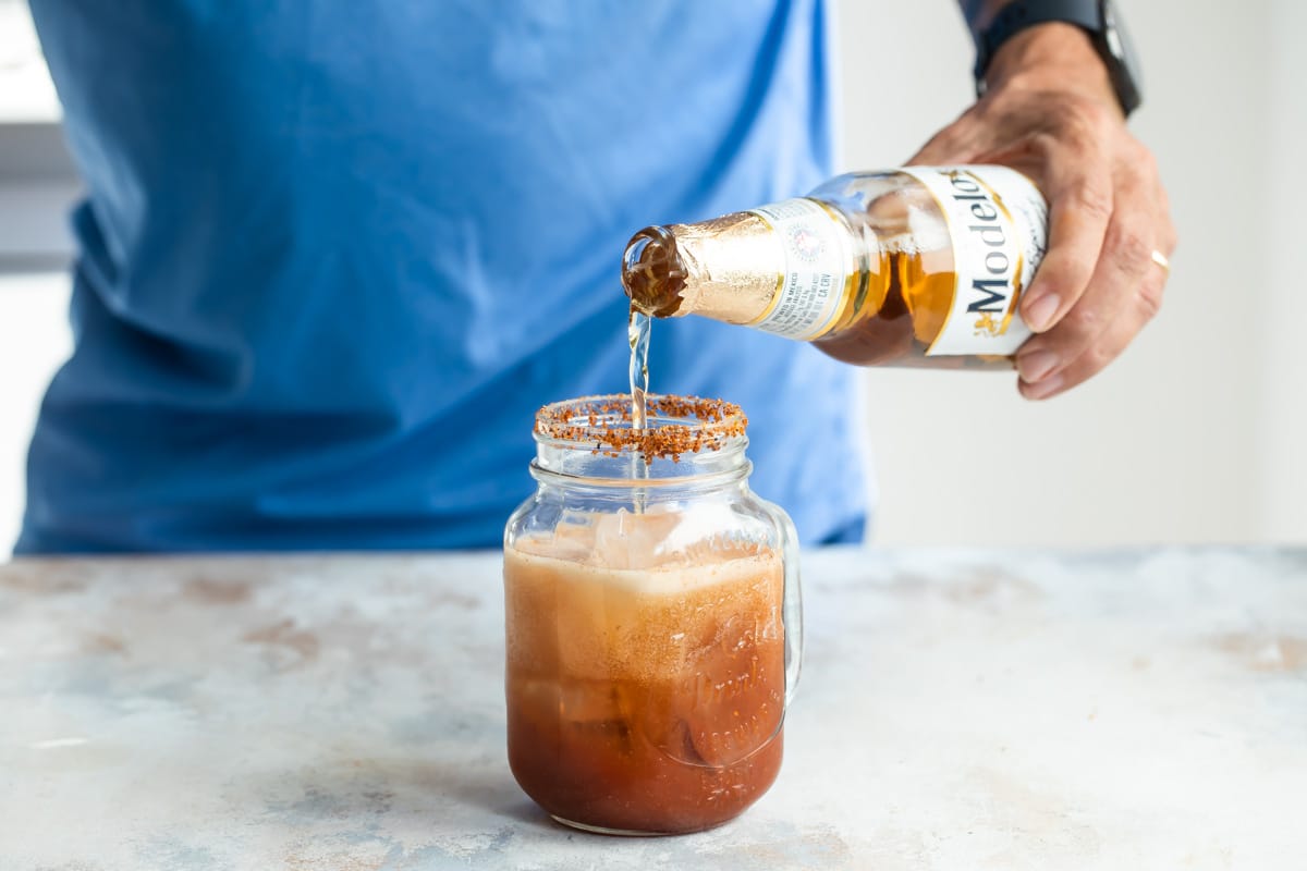 Add Mexican beer to a drink to make a Michelada.