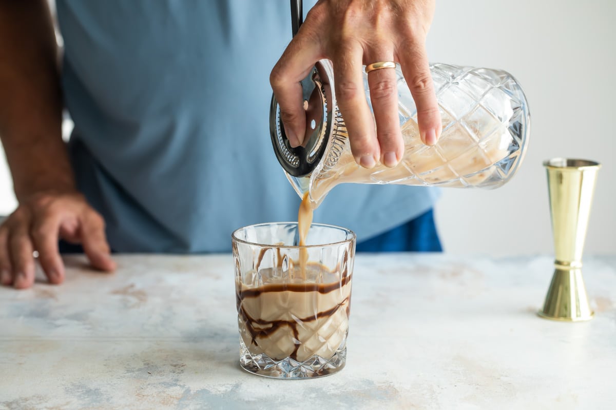 Straining a mudslide into a cocktail glass.