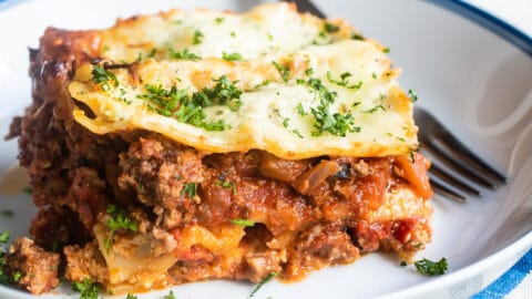 The best make ahead lasagna slice on a white plate.