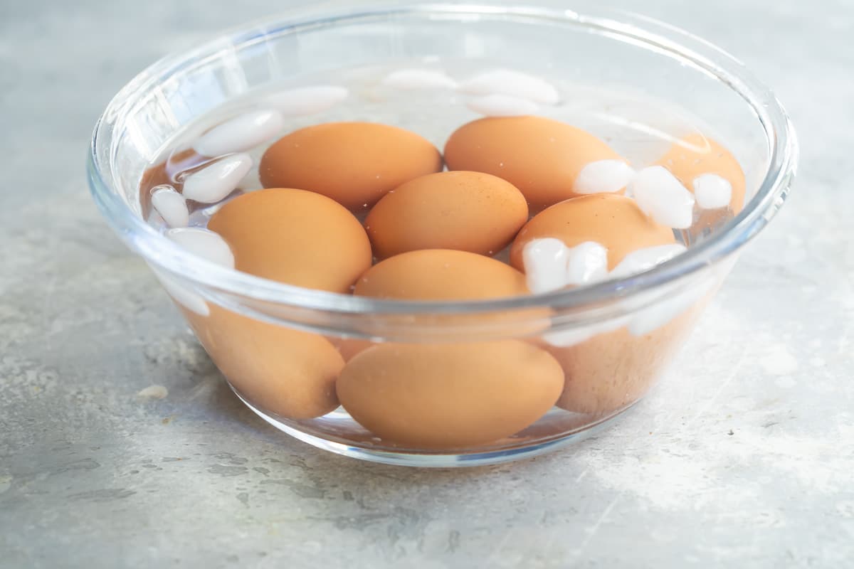 Hard-boiled eggs in ice water after cooking.