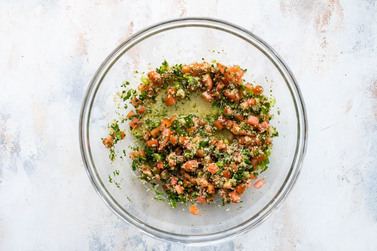 Quinoa tabbouleh in a clear bowl.
