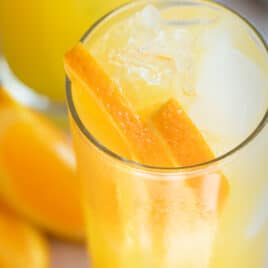 A fuzzy navel with ice and orange slices.