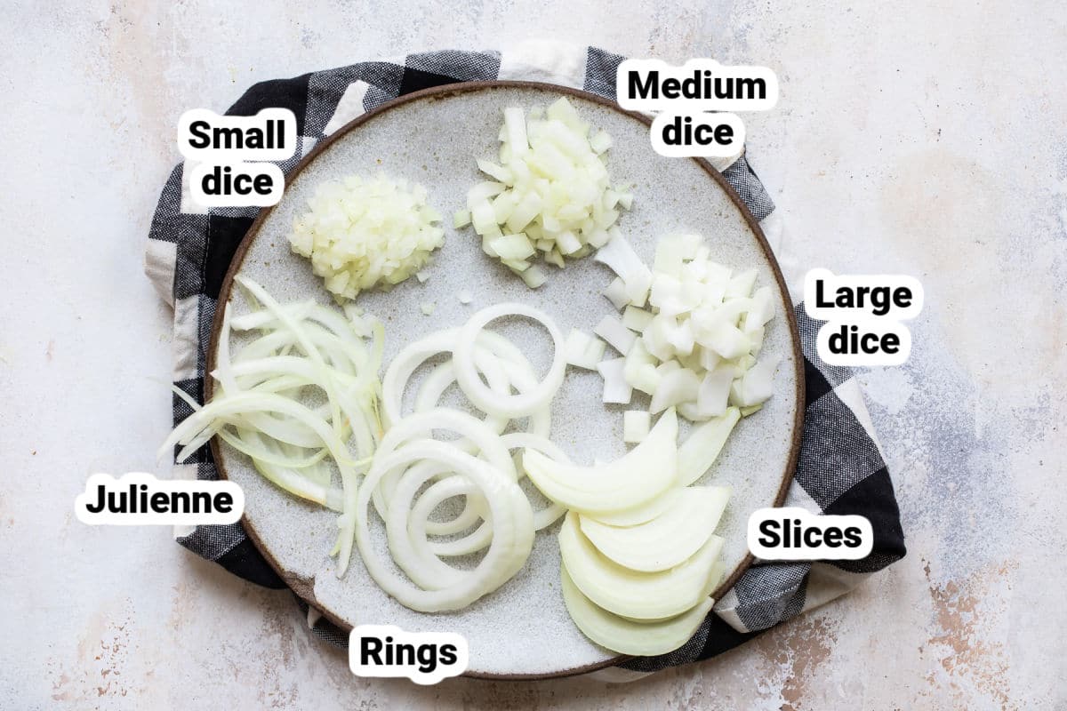 Onions diced, sliced, and julienned on a plate.
