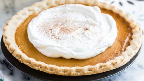 Make ahead pumpkin pie topped with whipped cream.