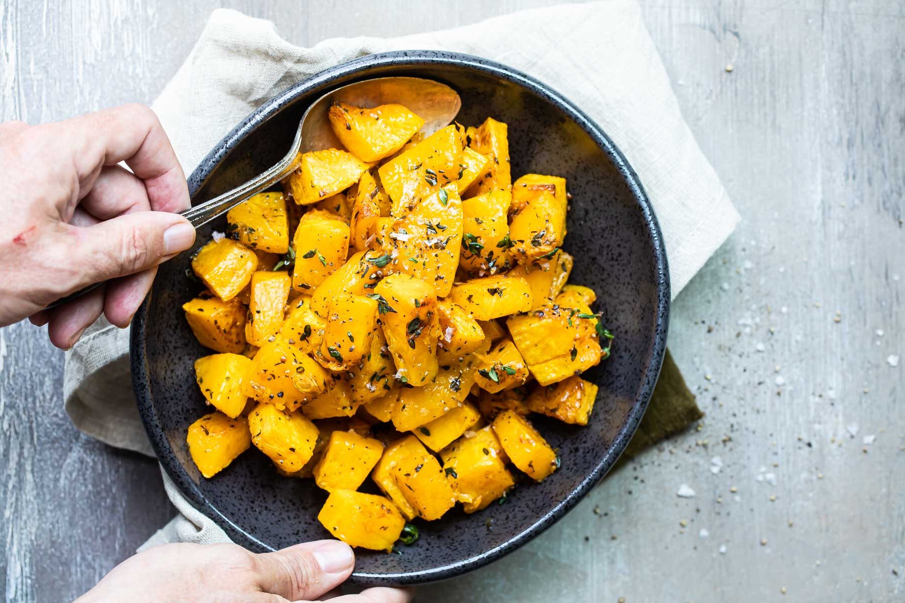 Roasted butternut squash in a serving bowl.