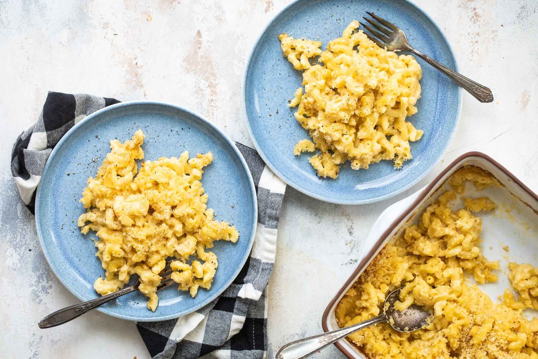 Two plates of macaroni and cheese.
