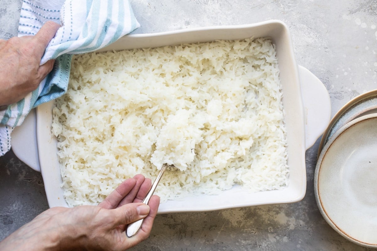 Baked rice in a white baking dish.