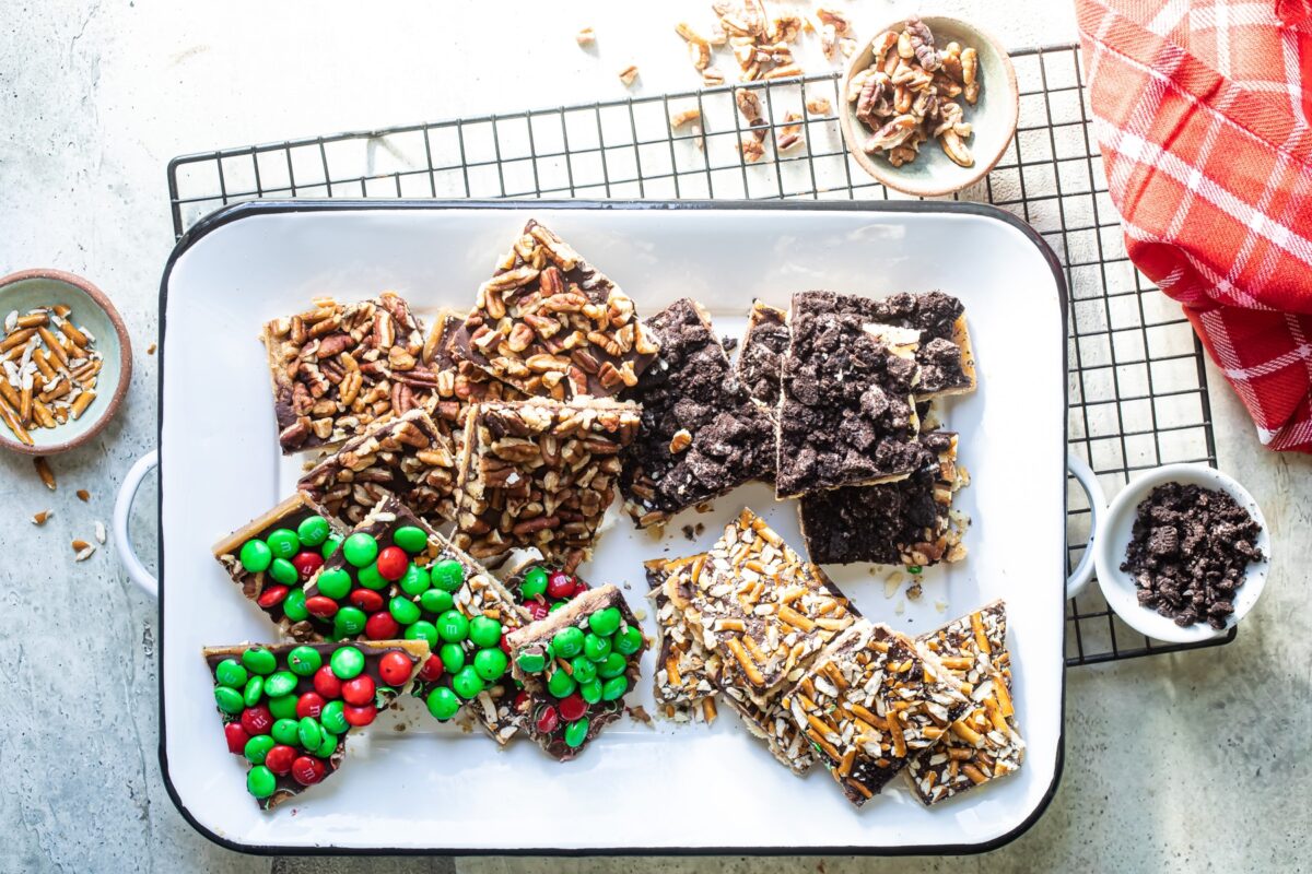 Four flavors of christmas crack on a white platter.
