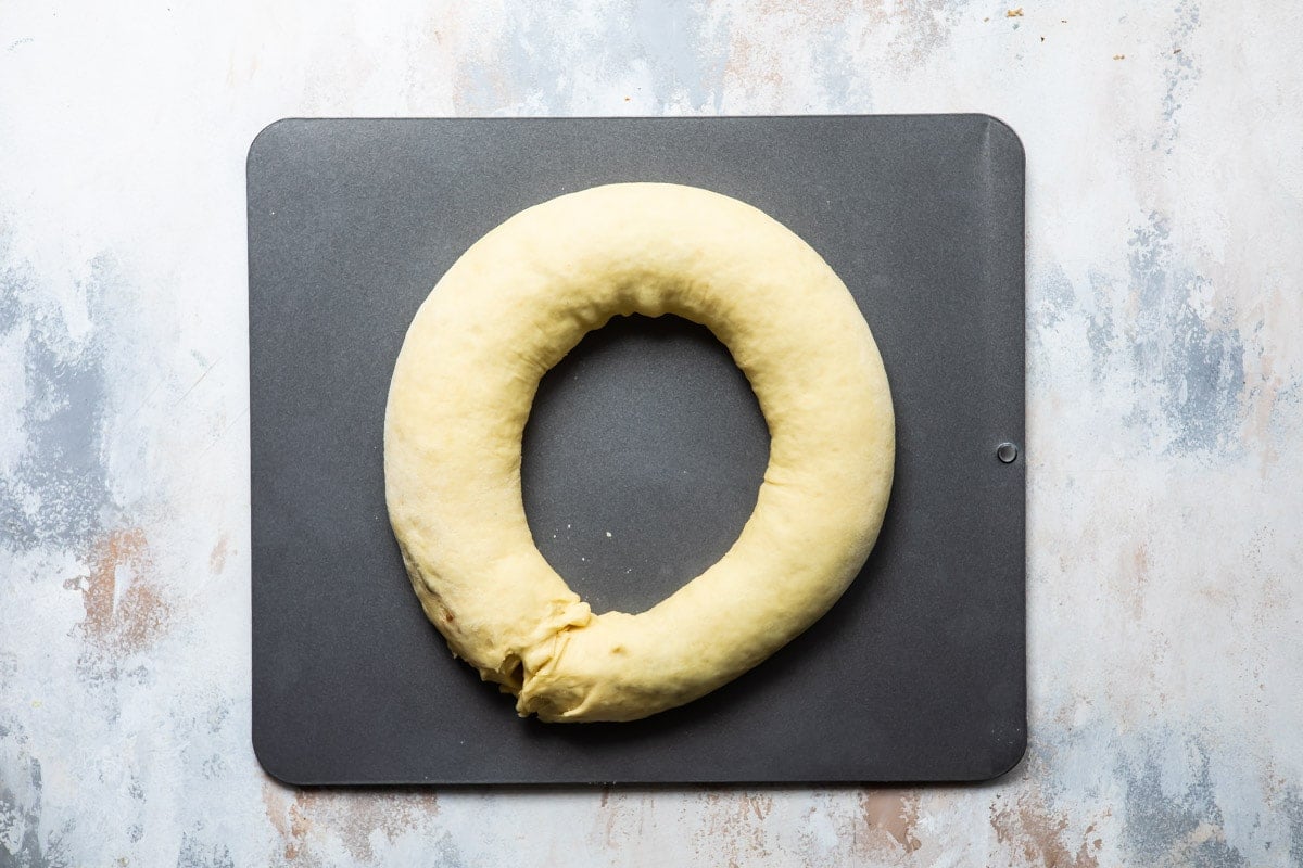 King cake dough on a baking sheet.
