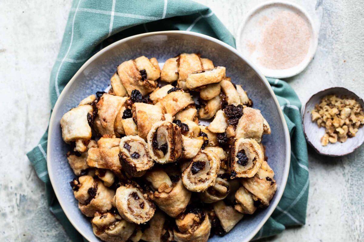 Baked rugelach in a white serving bowl.
