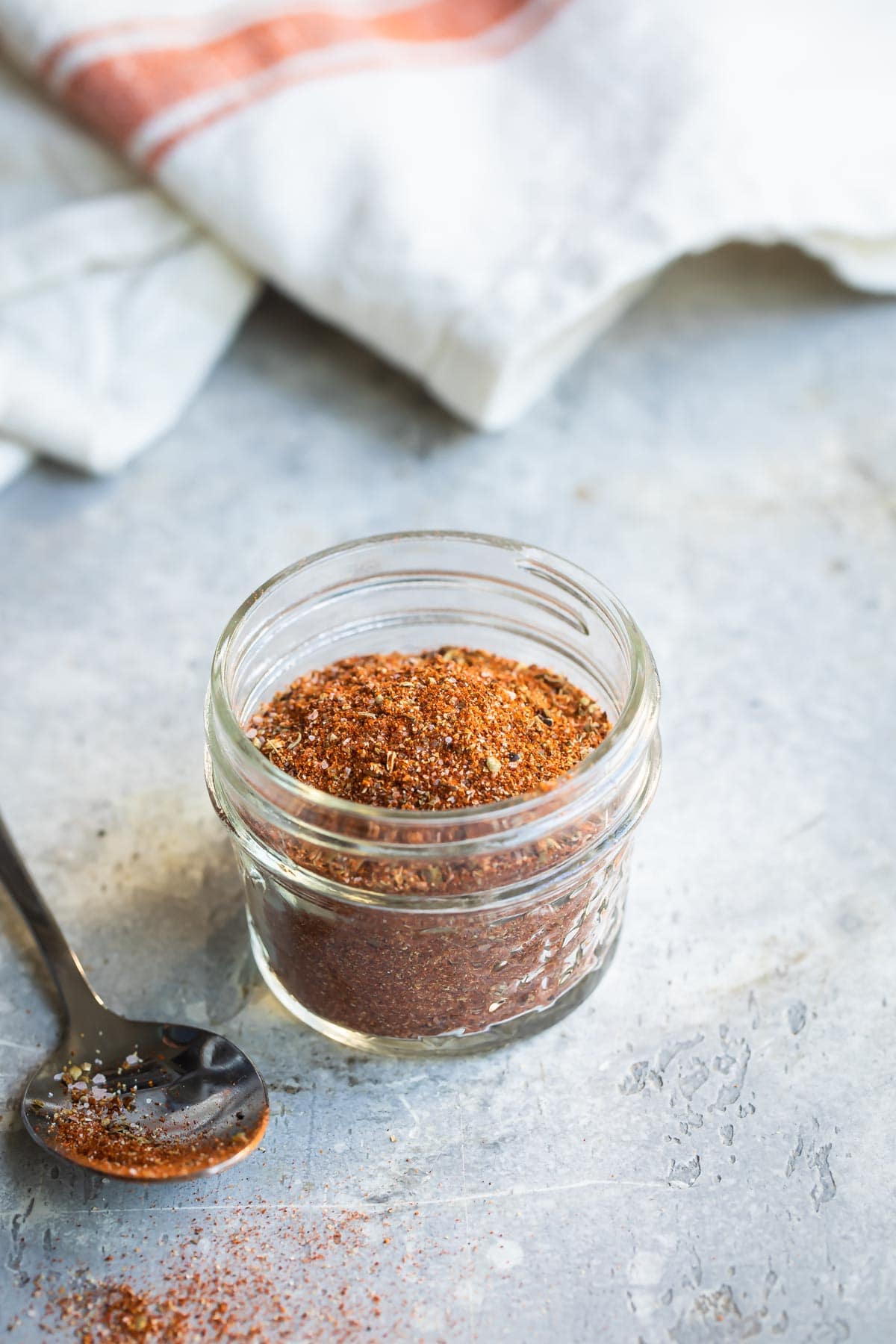 Creole seasoning in a small clear jar.