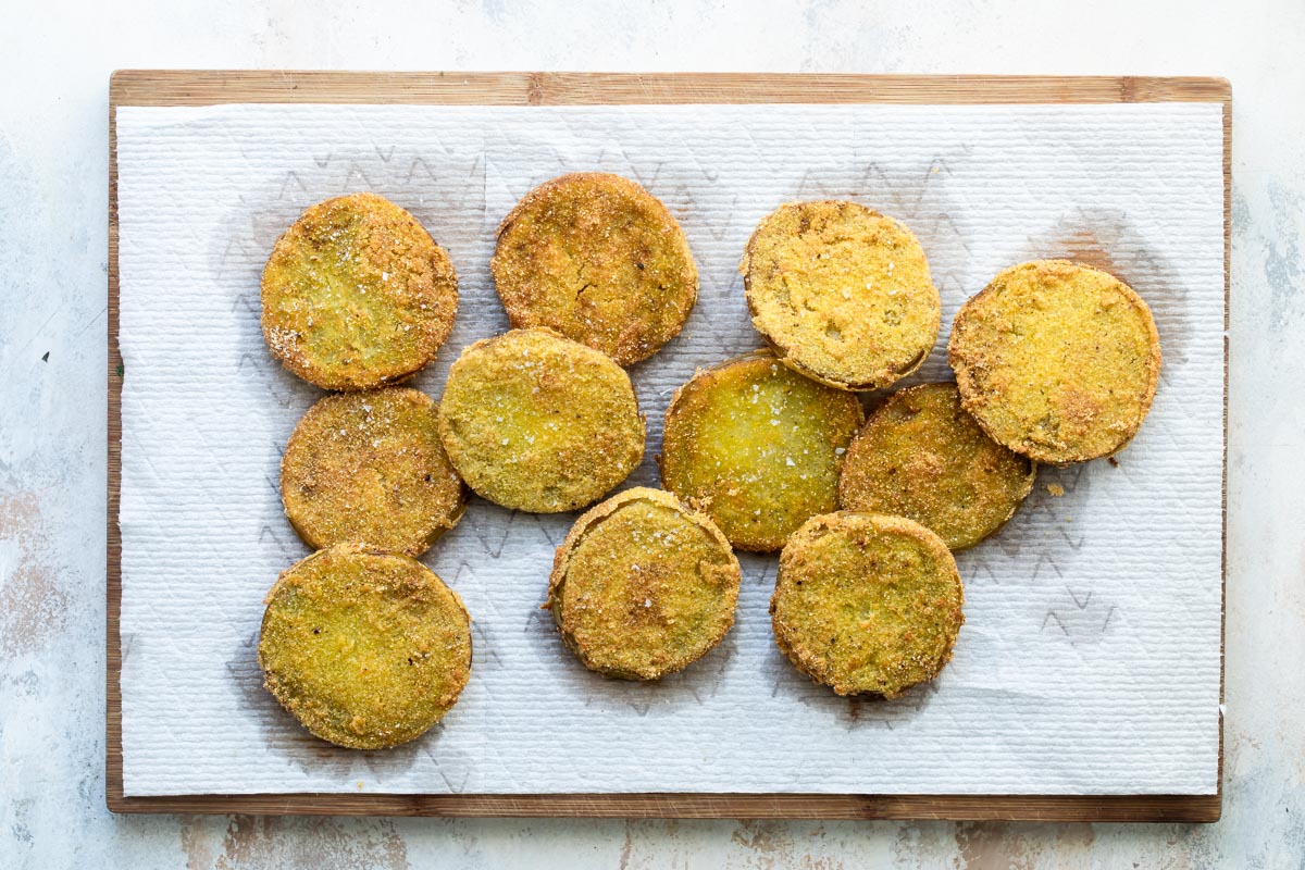 Fried green tomatoes on a baking sheet.