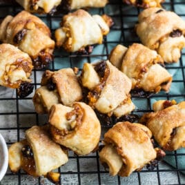 Baked rugelach on a cooling rack.