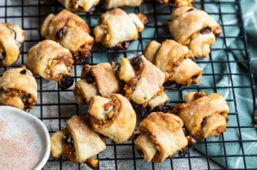 Baked rugelach on a cooling rack.