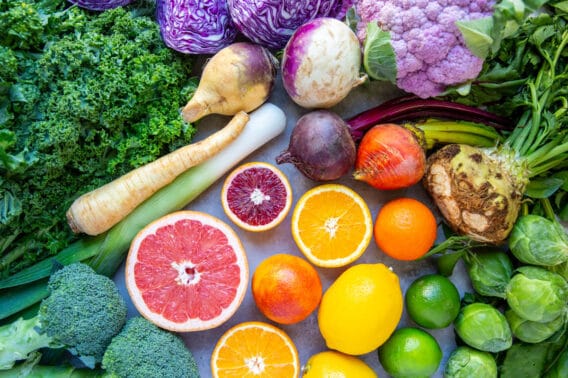 An assortment of citrus, cruciferous vegetables, and root vegetables (seasonal produce for the month of February).