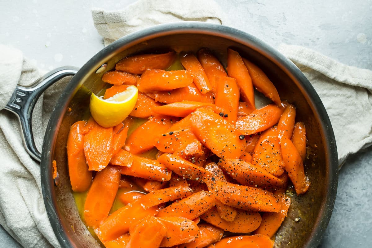 Glazed carrots in a saucepan.