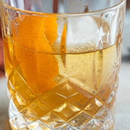 An Old Fashioned cocktail in a rocks glass.