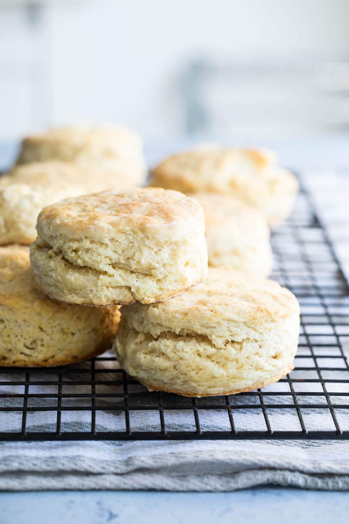 Buttermilk biscuits on a baking rack.