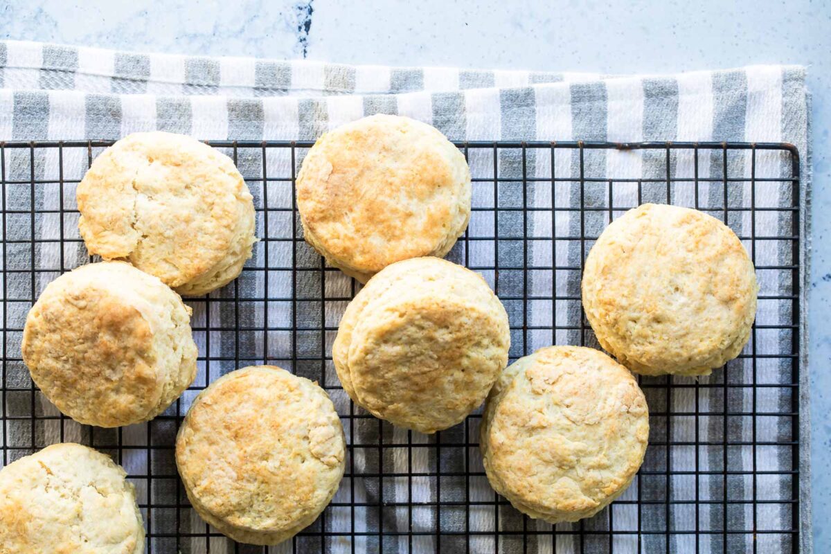 Buttermilk biscuits on a baking rack.
