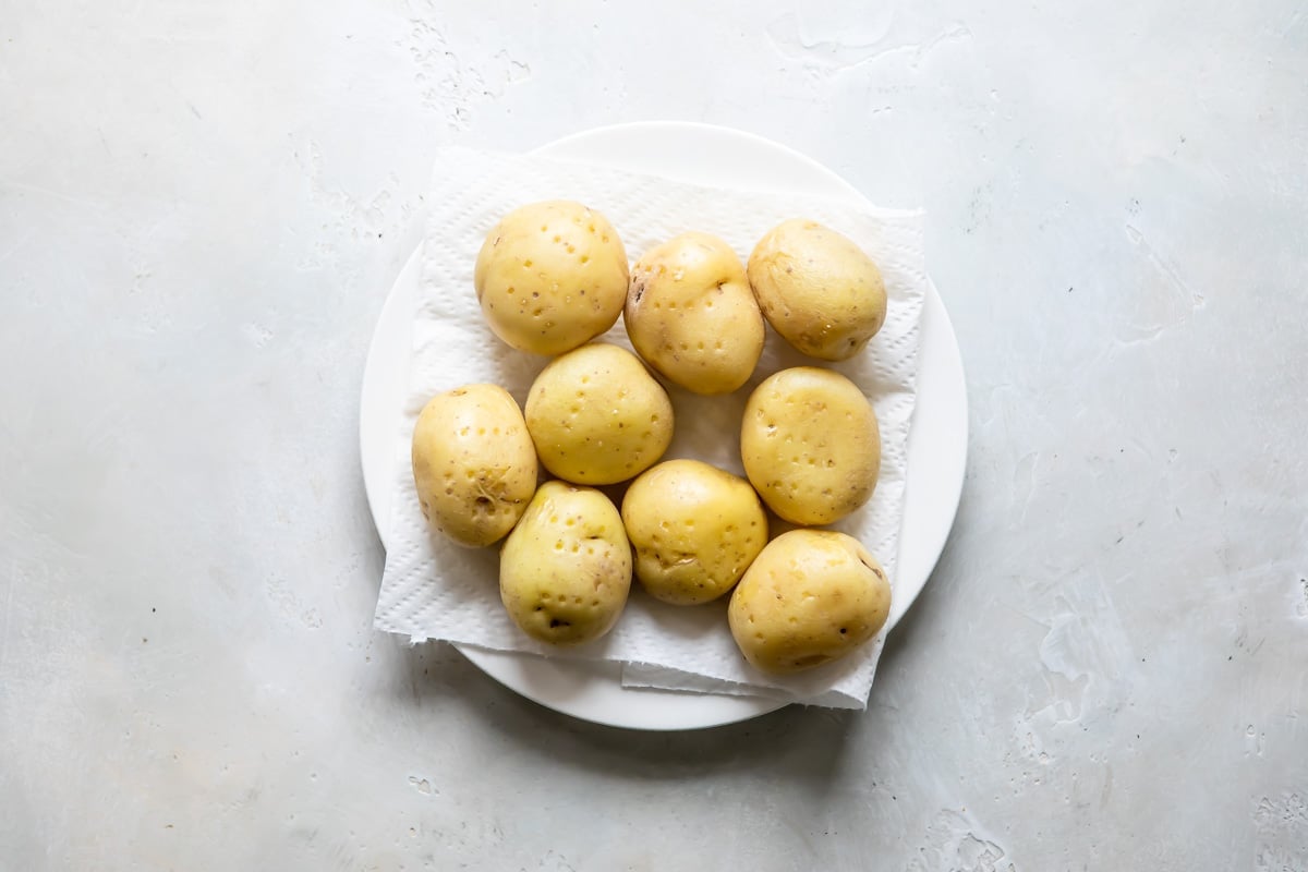 Mini potatoes on a white plate.