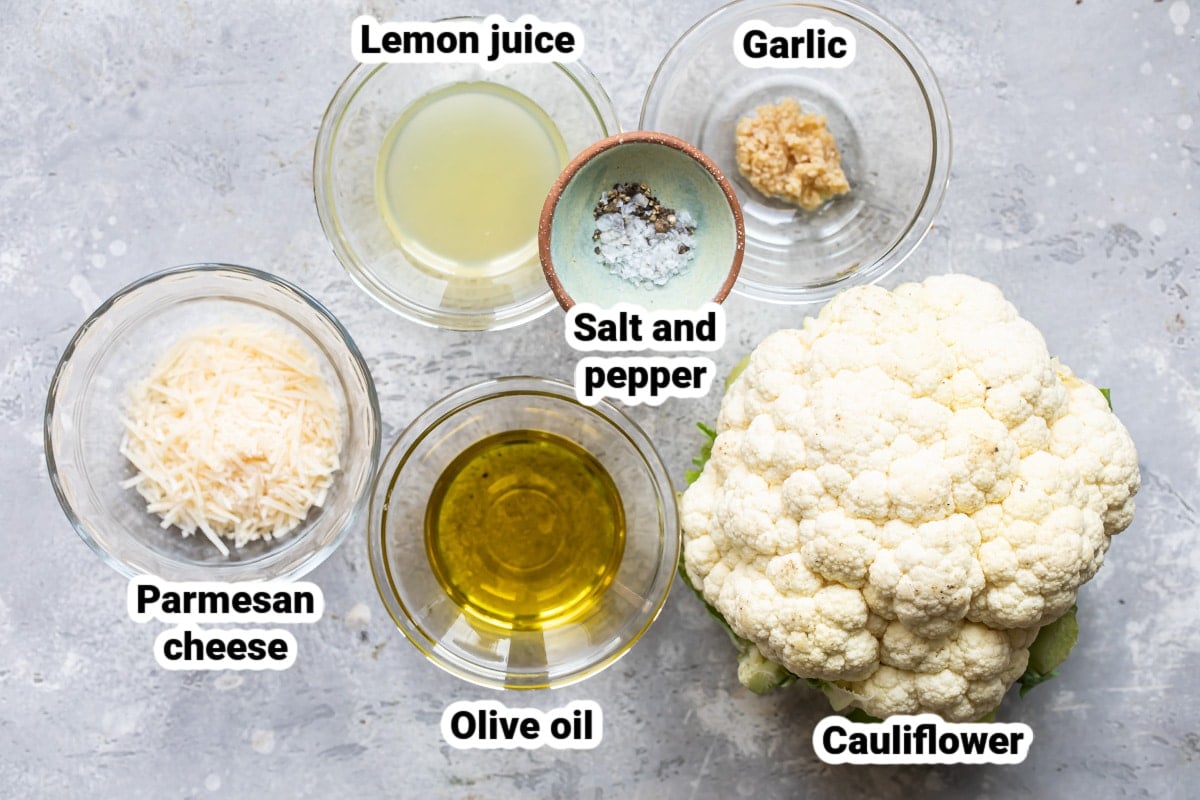 Labeled ingredients for roasted cauliflower with lemon and parmesan.