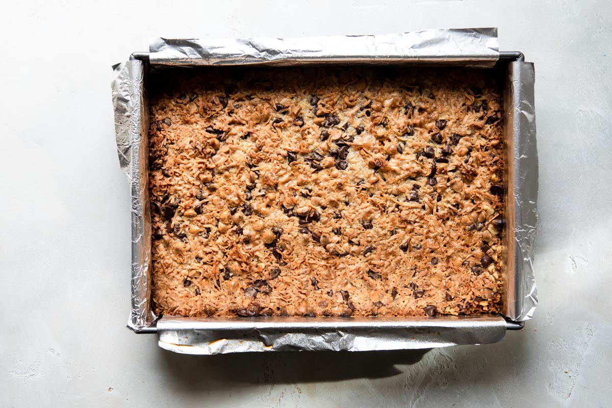 Seven layer bars squares in a baking pan.