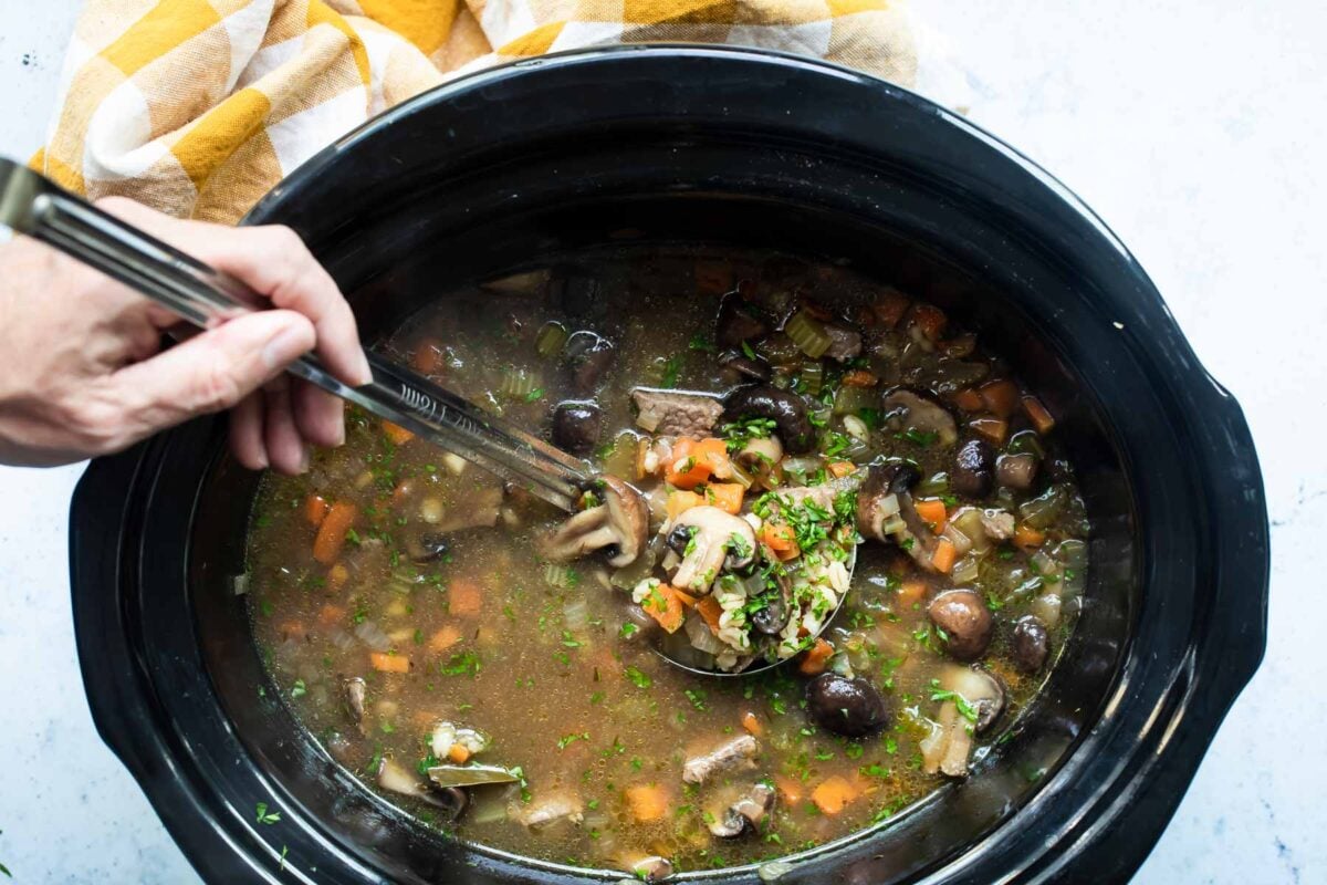 Slow cooker beef barley soup in a crockpot.