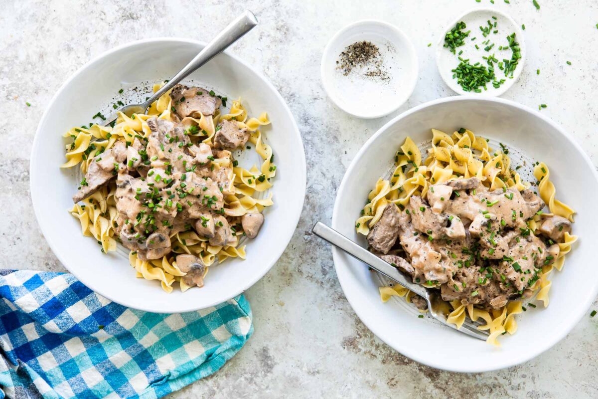 Two bowls of beef stroganoff.
