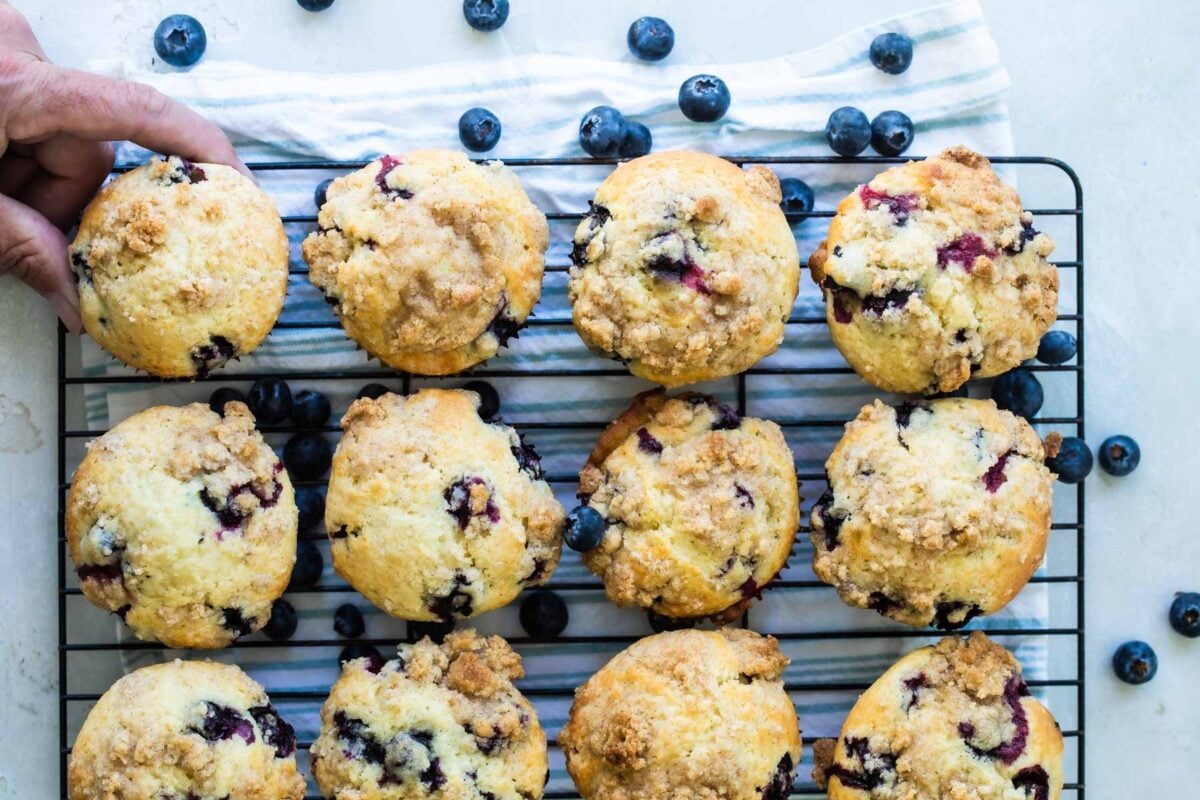 Blueberry muffins on a cooling rack.