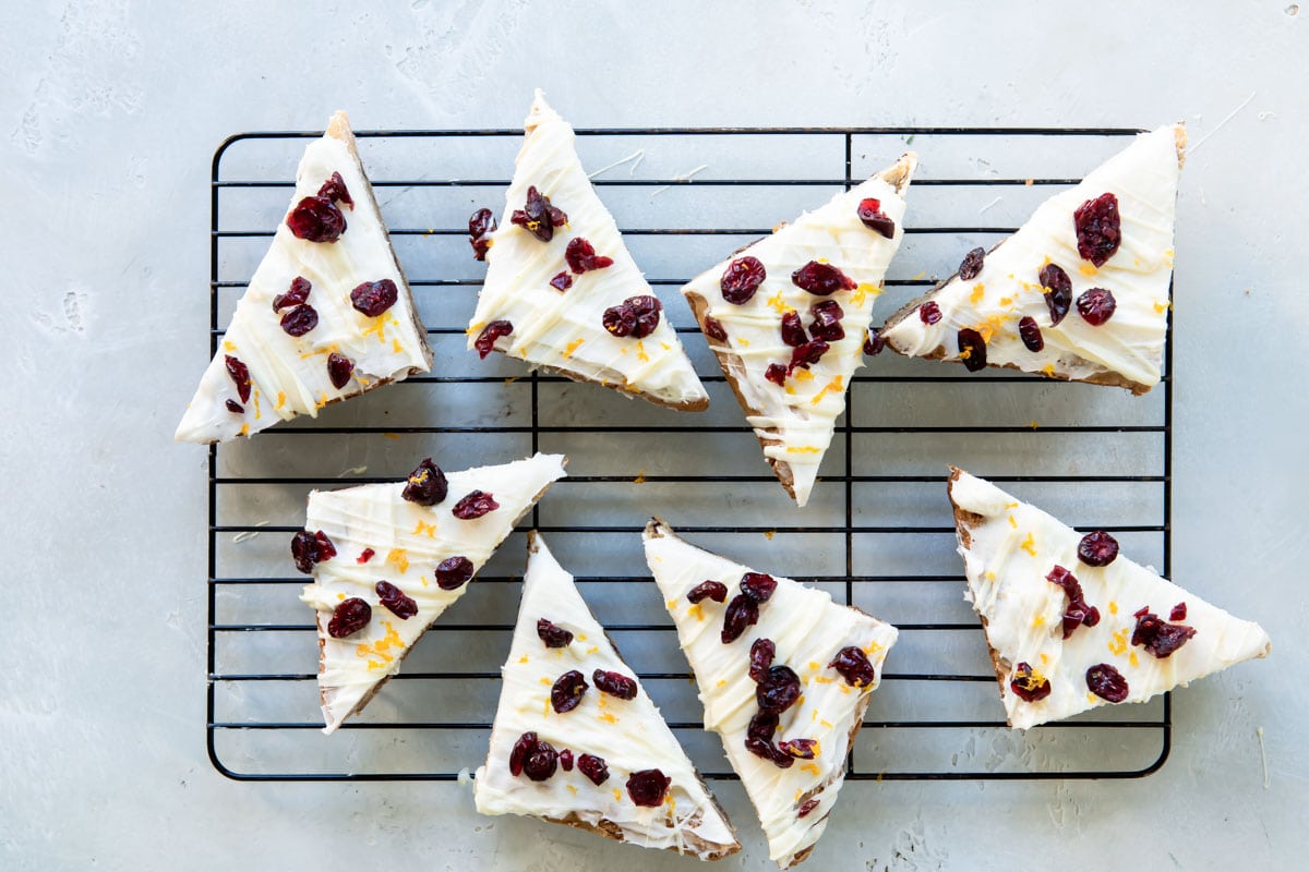 Cranberry bliss bar triangles cooling rack.