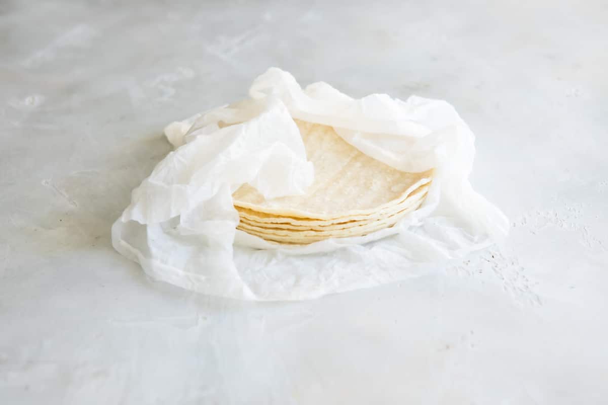 Tortillas wrapped in a damp paper towel.