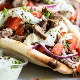 A beef gyro on a platter.