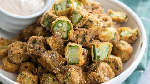 Fried okra pieces in a white bowl.