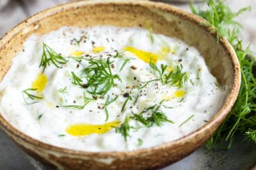Tzatziki Sauce in a small brown bowl.