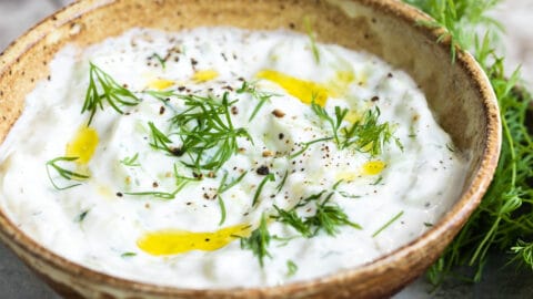 Tzatziki Sauce in a small brown bowl.