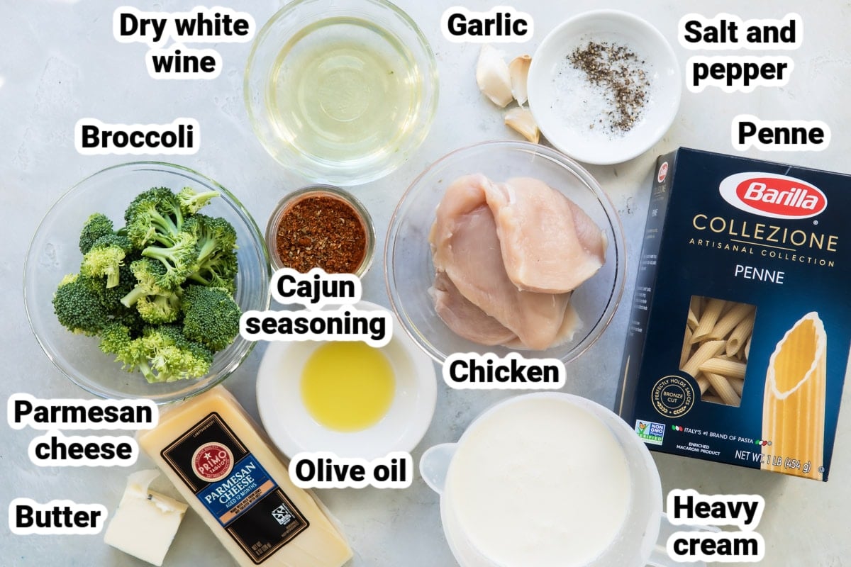 Labeled ingredients for cajun chicken alfredo with broccoli.
